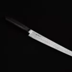 Full view of the Skelmis Sujihiki Sakimaru, showcasing its high-quality handmade damascus steel blade and ergonomic handle.