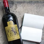 Front view of Amarone della Valpolicella DOCG organic wine bottle, showing elegant label and deep ruby-red color.