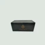 Armand De Brignac Brut Gold Champagne box featuring the iconic gold Ace of Spades emblem, symbolizing elegance and exclusivity.