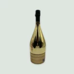 Armand De Brignac Brut Gold Magnum 1.5L champagne bottle showcasing its iconic golden design from the back side.