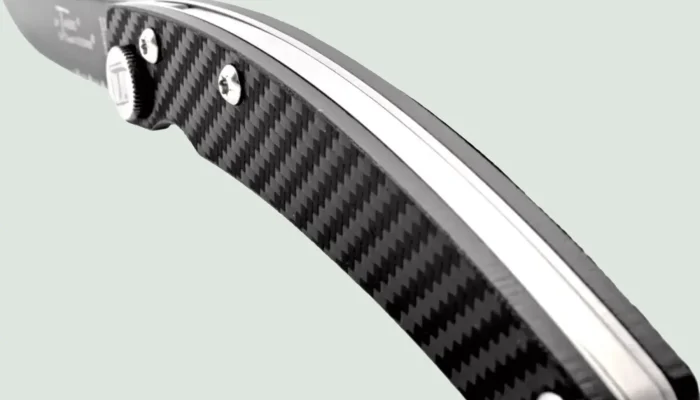 Close up of carbon handle and black blade by Claude Dozorme Close up of carbon handle and black blade by Claude Dozorme