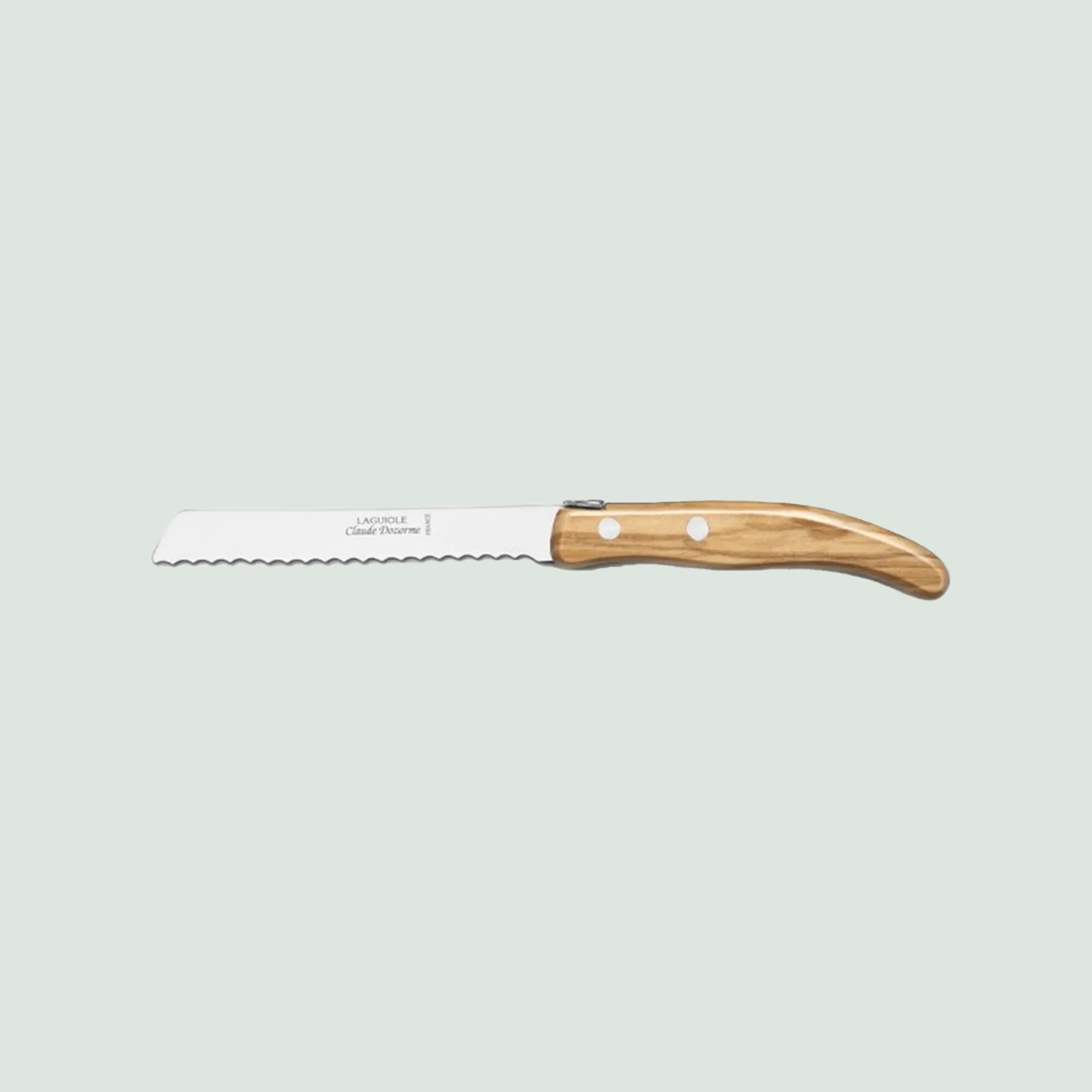 Claude Dozorme Bread Knife with Colorful Handle – Handcrafted in France Close-up of the Claude Dozorme bread knife with colorful handle and serrated blade, handcrafted for precision slicing
