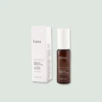 Close-up of Brightening Vitamin C Serum bottle next to its packaging, showcasing the label and product details.