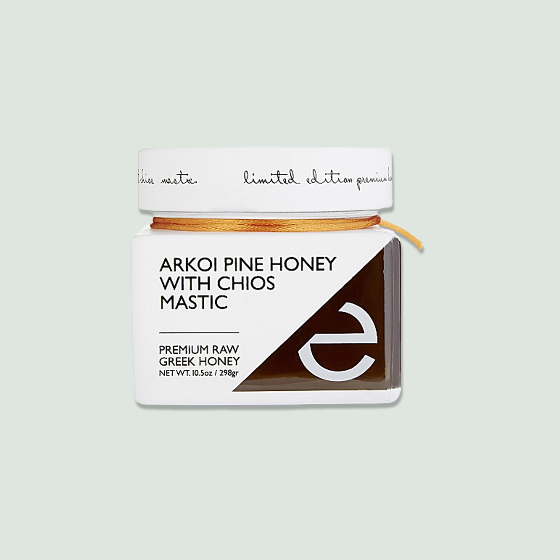 Arkoi Pine Honey with Chios Mastic Jar - Front View Front view of a jar of Arkoi Pine Honey with Chios Mastic, showcasing the vibrant label and rich, dark honey inside.
