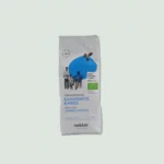A package of Nektar Traditional Greek Coffee. The white package features blue accents, an image of people enjoying coffee, and text indicating it is organic coffee.
