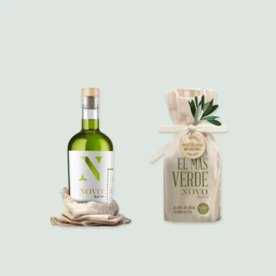 A bottle of El Más Verde Novo extra virgin olive oil showcasing its rich green color against a rustic background.