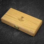 Four Claude Dozorme steak knives presented in a solid oak gift box