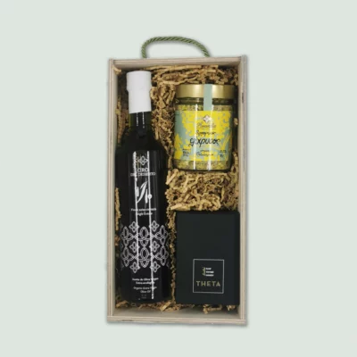 A luxury gift box featuring a bottle of Oro Del Desierto 1/10 Limited Edition, a Lavandia Helichrysum 30 gram container, and a THETA Raw Thyme Honey.