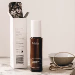 Close-up of Protective CQ10 Moisturiser bottle with its packaging, highlighting key ingredients like Coenzyme Q10 and Raspberry Seed Oil.
