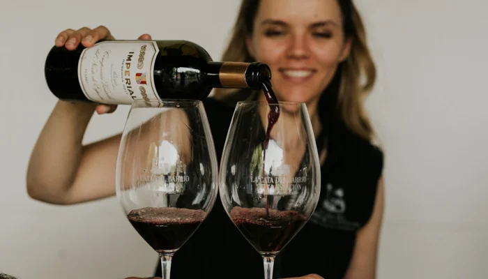 Pouring Rioja red wine into a glass Pouring Rioja red wine into a glass