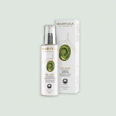 Olium Make-Up Remover bottle next to its packaging, highlighting its natural and organic ingredients.