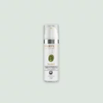 A close-up of the OLIGAR Anti-Aging Serum bottle showcasing its elegant design and label featuring bio EVOO, hyaluronic acid, and horehound extract.