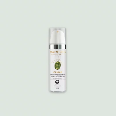 A close-up of the OLIGAR Anti-Aging Serum bottle showcasing its elegant design and label featuring bio EVOO, hyaluronic acid, and horehound extract.