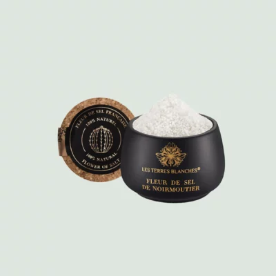 Fleur de sel de Noirmoutier salt in black ceramic jar with spoon – open jar