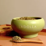 Gourmet gift set with olive oil and dried oregano on rustic table