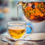 A freshly brewed cup of Cistus Incanus tea, showcasing its rich amber color and natural wellness benefits.