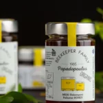 The organic Paliouri honey bottle placed on a counter top