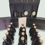 Three Greek Olive Oil Experimental Edition packages and their bottles displayed together.