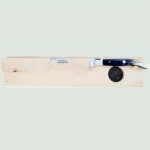 Close-up of carving knife with black horn handle and stainless steel bolster