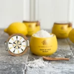 Fior di Sale Sicilia in artisan ceramic jar with wooden spoon – front view