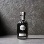 Close-up of balsamic bottles on table