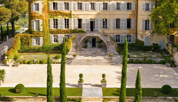 Château d’Estoublon estate nestled in the Alpilles mountains landscape Château d’Estoublon estate nestled in the Alpilles mountains landscape