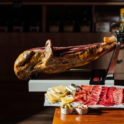 Close-up of Jamón Gran Reserva showing texture, fat distribution, and rich golden hues
