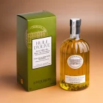 Close-up of golden olive oil with fresh green reflections