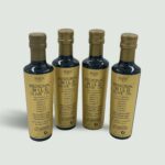 Four bottles of Sparta Medicinal Gold Label high phenolic olive oil