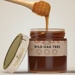 Dark amber oak honey with dense texture and mineral richness